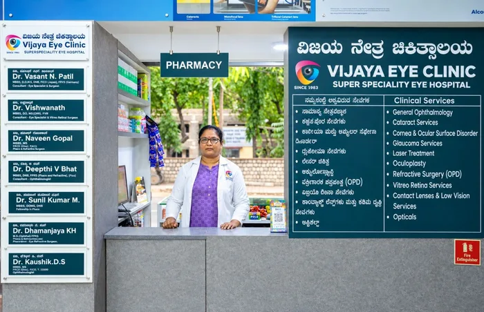 Hospital pharmacy counter with registered pharmacist and clinical services directory board